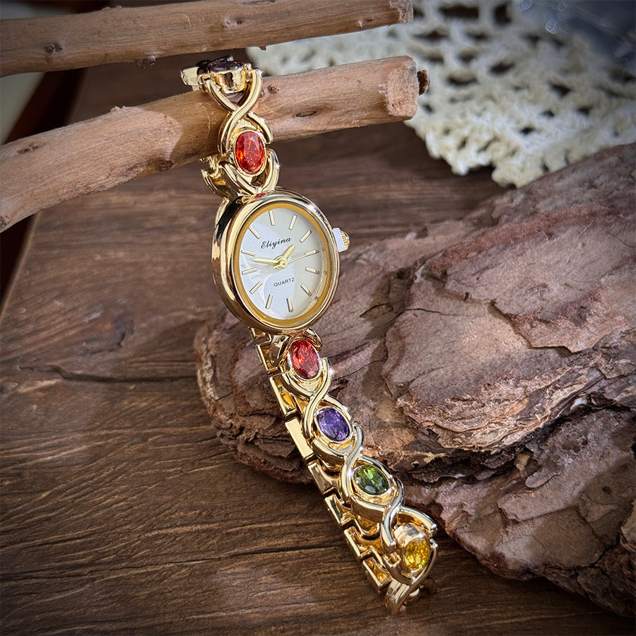 Oval watch with gemstones and diamonds