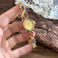 Oval watch with gemstones and diamonds