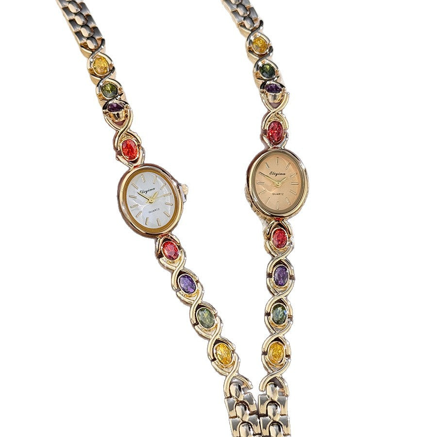 Oval watch with gemstones and diamonds